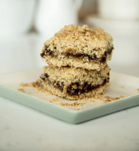 Date squares stacked on a plate